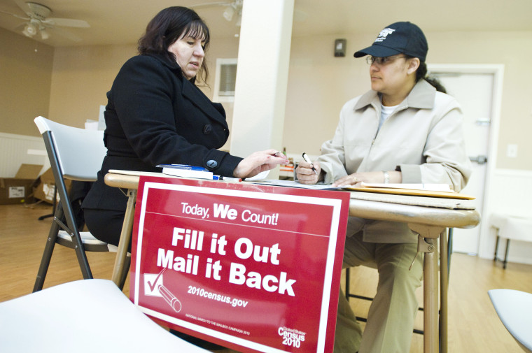 Image: Partnership specialists, Zee Quintana, left, and Cristina Vaccaro discuss details of the 2010 Census form