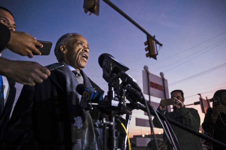 Image: The Rev. Al Sharpton speaks with members of the media