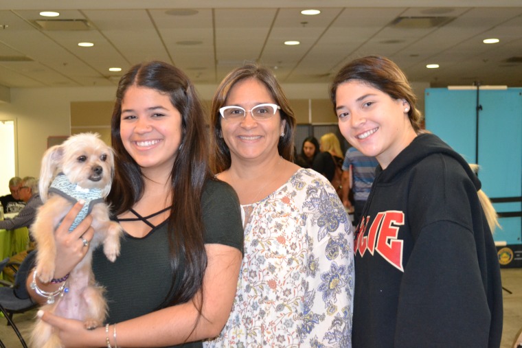 Victoria Sola (Left) with her mother, Nadya Navarro, (Center) and friend, Andrea Marrero (Left). Sola and Marrero recently arrived from Puerto Rico and have enrolled at Florida International University. They were at the hurricane relief center in Miami International Airport on November 29, 2017.