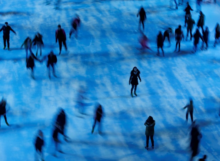 Image: Skaters circle the ice rink at Somerset House in London