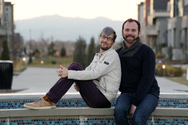 Image: Gay married couple David Mullins and Charlie Craig pose for a photo in Denver