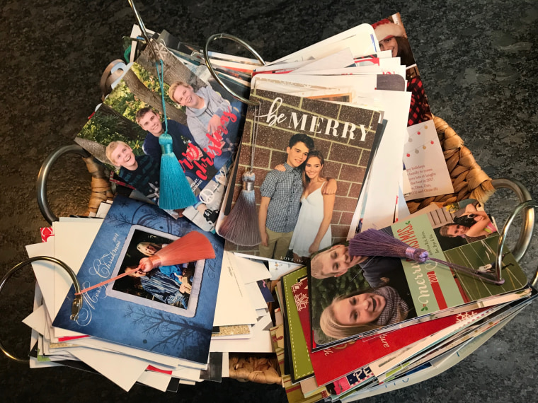 Not only are they festive and a great way to stay organized, Holiday Card Rings also provide a perfect way to divert awkward conversations during the family holiday party. Just look at old cards!