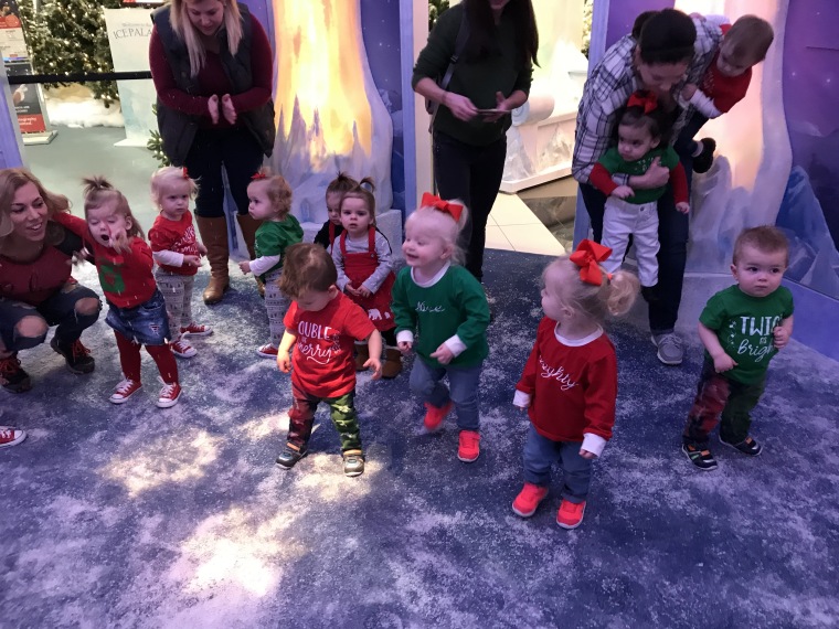 While they waited for their turn with Santa, all 20 of the twin toddlers waited in a holding are shaped like a snow globe - complete with fake snow. "That was the really wild part," said Stacy Kifer, mom of 16-month-old boys Kaleb and Kobe.