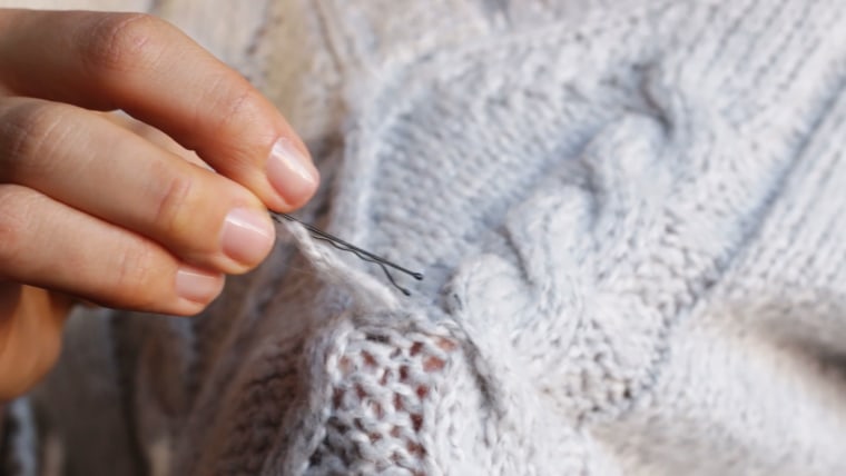 How to fix a sweater snag with an unlikely hair tool