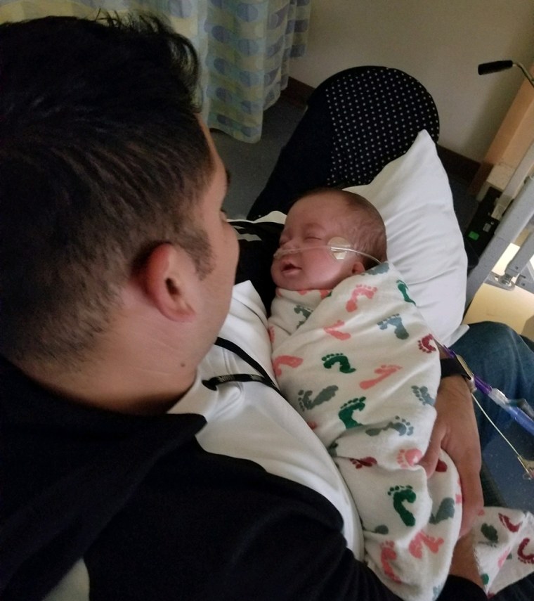 Police officers part of the cuddle watch for baby Axel often fell asleep cuddling with the baby.