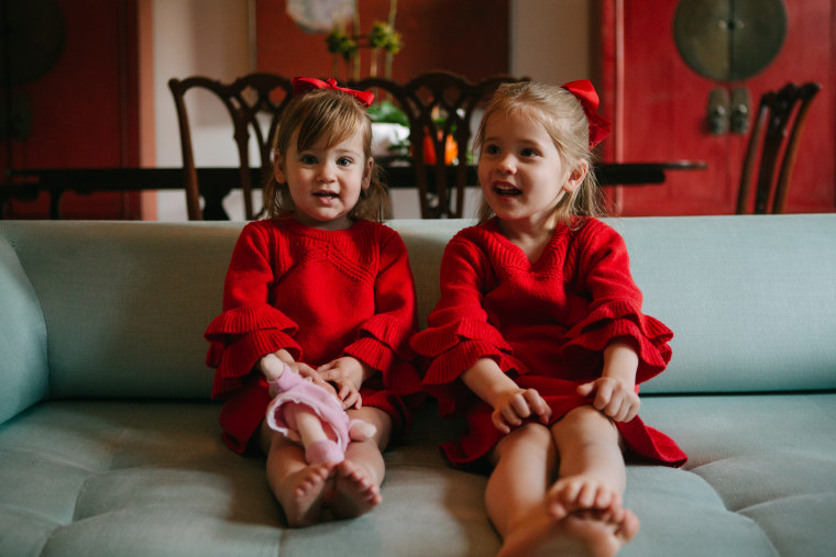 Love the matching red dresses and bows!