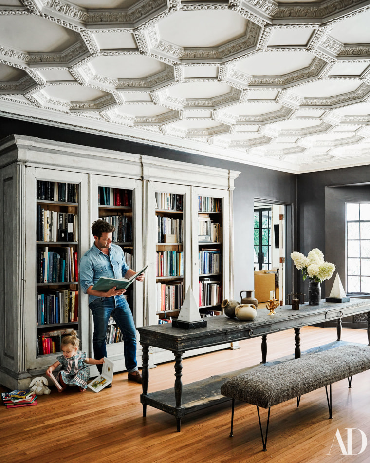 Nate Berkus and daughter Poppy in their home's gallery.