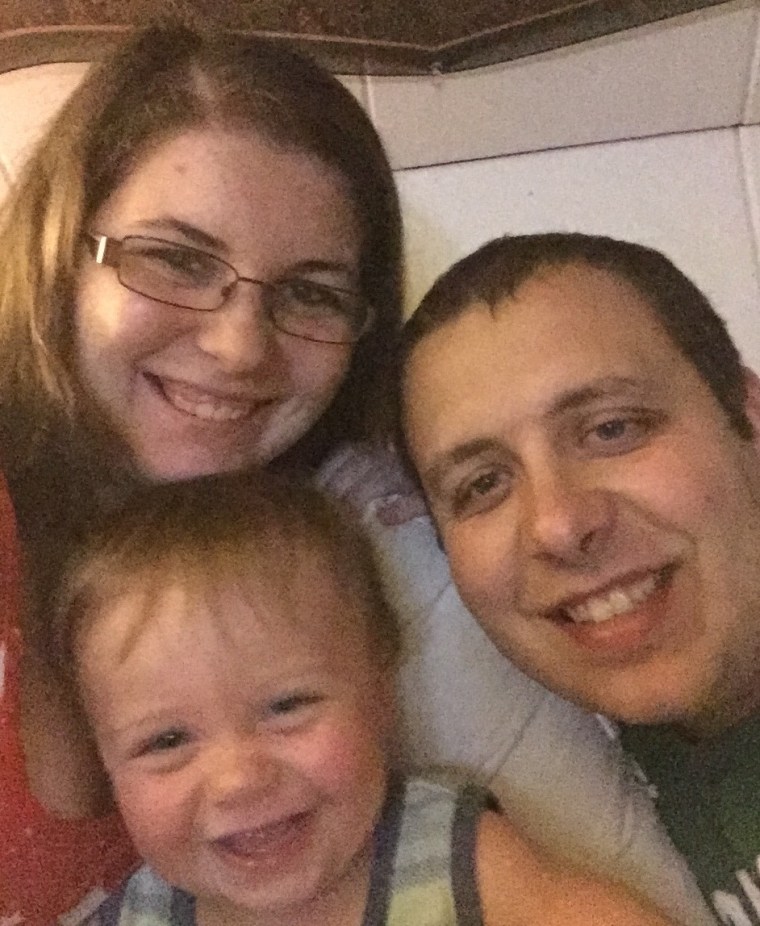 Nathan Lambert with his parents, Kelsey Higgins and Jordan Lambert.