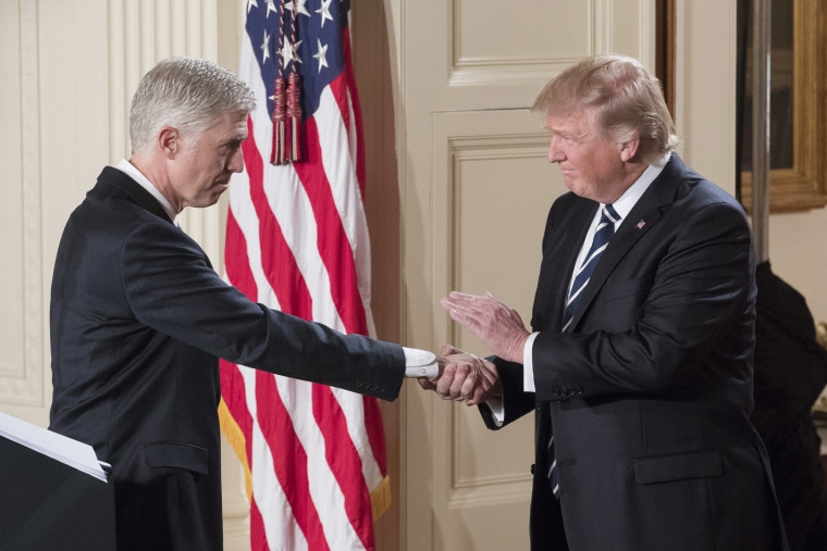 Image: Trump shakes hands with Neil Gorsuch after announcing him as his Supreme Court nominee