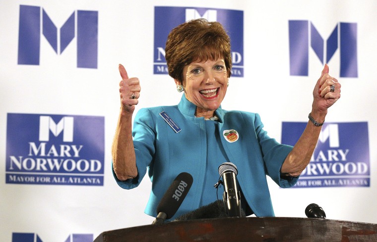 Image: Mayoral candidate Mary Norwood gives supporters a double thumbs up in Atlanta