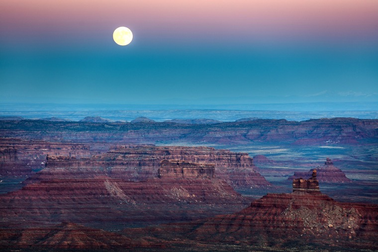 Image: A nearly-full 'supermoon' rises at dusk above the Valley of the Gods in Bears Ears National Monument near Mexican Hat