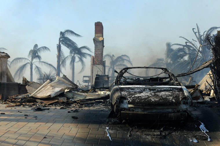 Image: Remains of a home are seen after wind-driven wildfire in Ventura, California