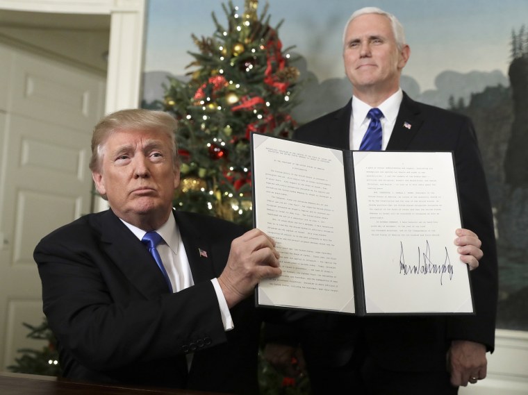 Image: President Donald Trump holds a proclamation to recognize Jerusalem as the capitol of Israel