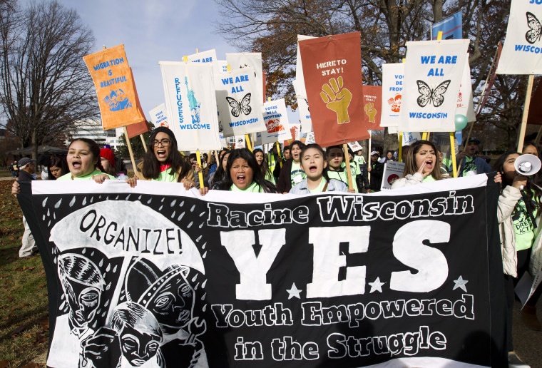 Image: Demonstrators march during an immigration rally in support of the Deferred Action for Childhood Arrivals