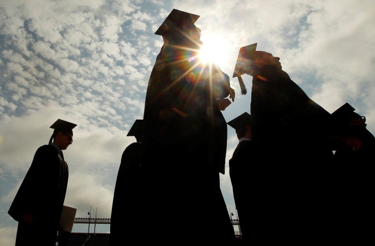 Image: FILE PHOTO: Graduating students arrive for Commencement Exercises at Boston College in Boston