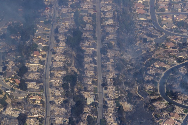 Image: Dozens of homes are destroyed in a neighborhood in view of the Thomas fire from helicopter in Ventura County, California, on Dec. 5, 2017.