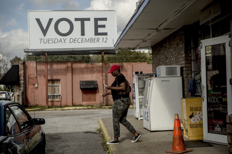 Image: A sign posted up by Vote.org, a non-partisan organization aiming to increase voter turnout and engagement, stands on Florida Street in Mobile, Alabama on Dec. 5, 2017.