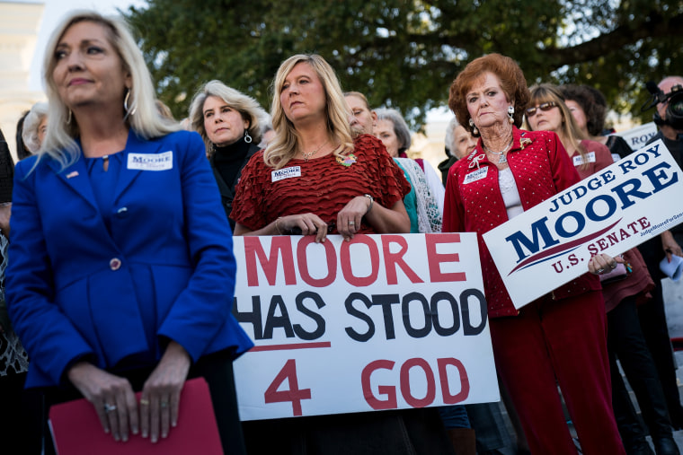 Image: Women attend a 'Women For Moore' rally in support of Republican candidate for U.S. Senate Judge Roy Moore, in front of the Alabama State Capitol, Nov. 17, 2017 in Montgomery, Alabama.