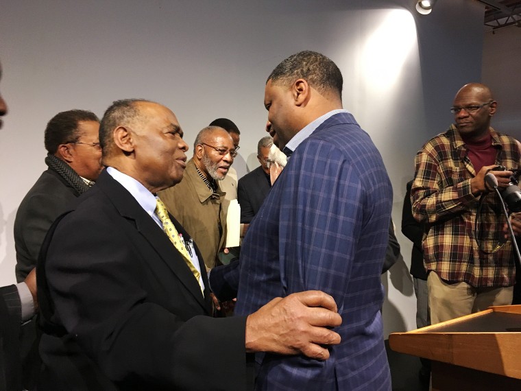 Image: NAACP President Derrick Johnson, right, speaks with Dr. Robert Smith, former president of the Medical Committee for Human Rights