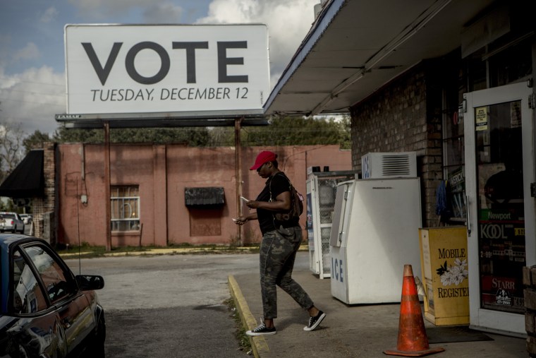 Image: A sign posted by Vote.org, a non-partisan organization aiming to increase voter turnout and engagement, stands on Florida Street in Mobile, on Dec. 5.