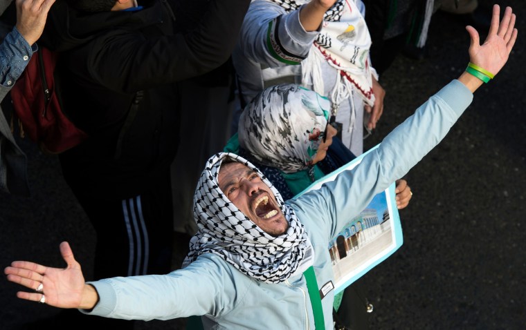 Image: A protester chants slogans against the United States and Israel