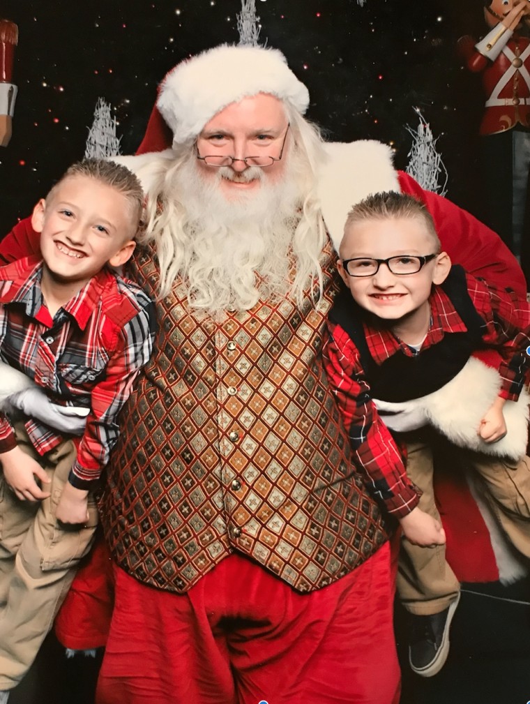 Alyssa Kitchenman's sons, Aiden, 9, and Landen, 7, with Santa Scott.