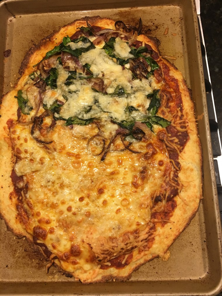 Cauliflower pizza with cheese and veggies