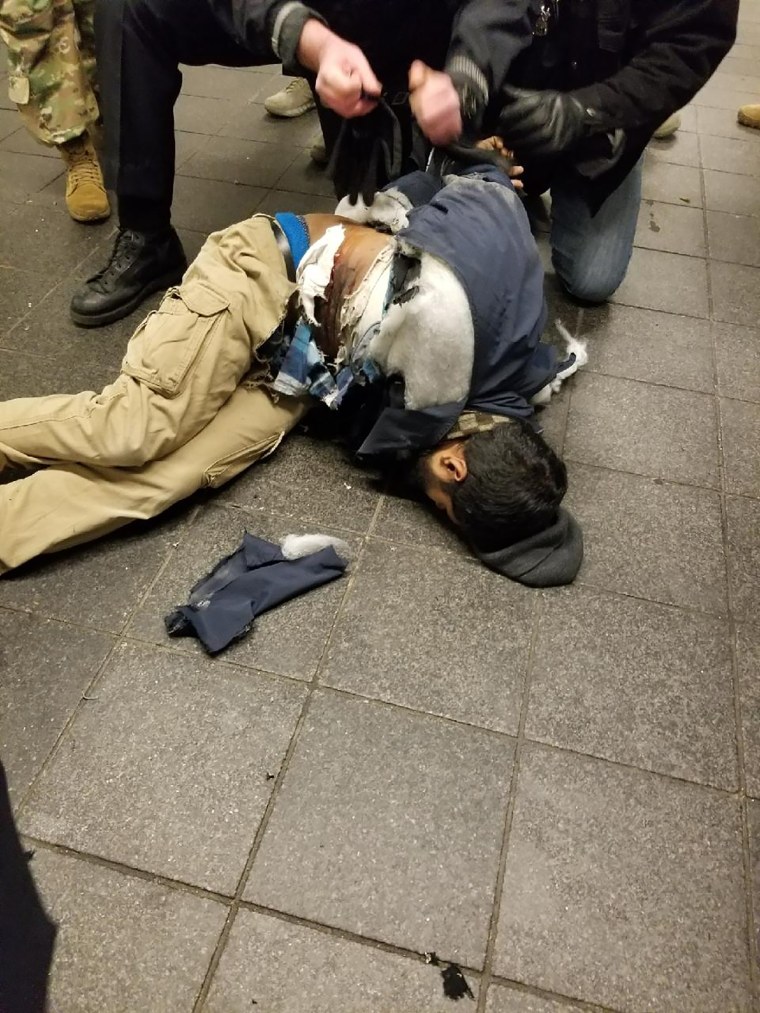 Image: Police take down Akayed Ullah, a 27-year-old Bangladeshi man suspecting of setting off a bomb at New York City's Port Authority Bus Terminal,on a subway platform between Times Square and Port Authority on Dec. 11, 2017.