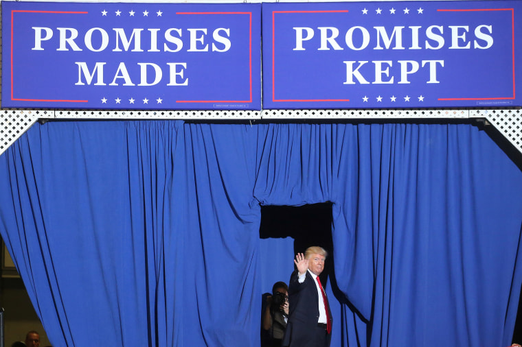 U.S. President Donald Trump waves on stage at a rally in Harrisburg