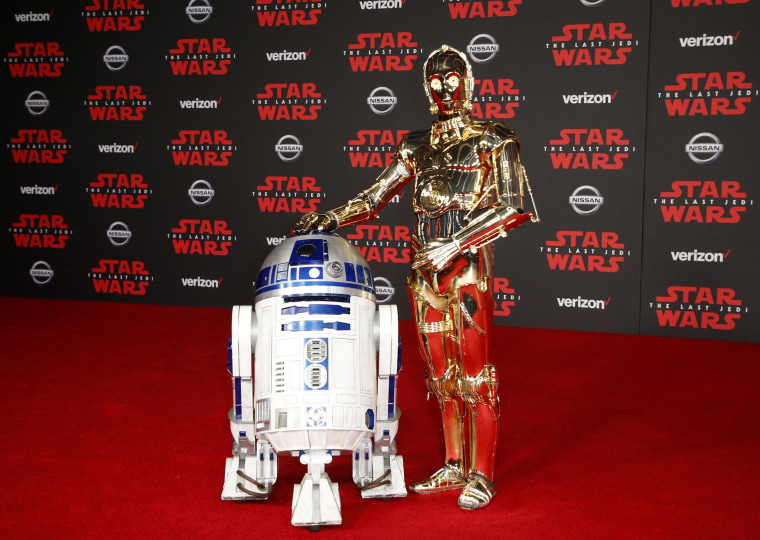 Image: R2-D2, left, and C-3PO walk the red carpet at the World Premiere of "Star Wars: The Last Jedi"