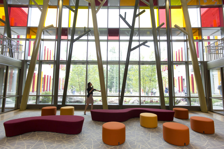 A visitor admires the lobby of the new Sandy Hook Elementary School during a media open house.