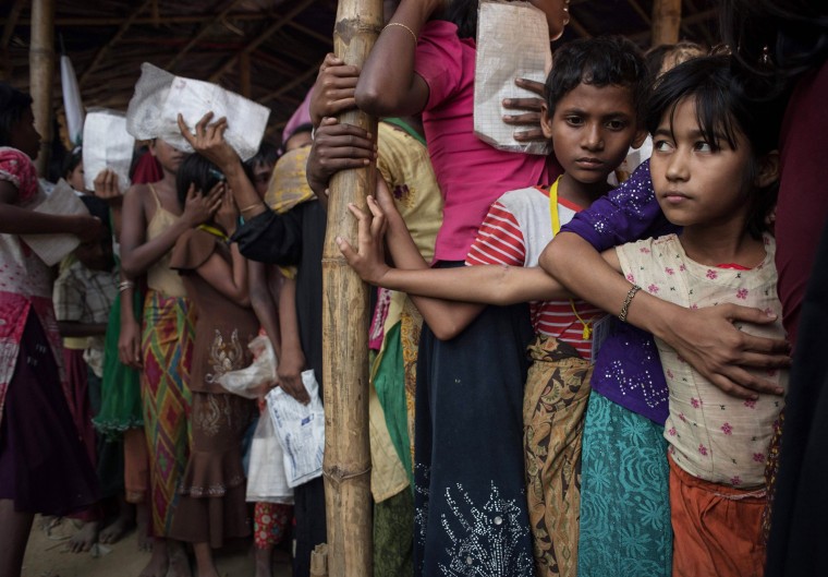 Image: Rohingya refugees wait at a relief center at the Balukhali refugee camp at Cox's Bazar