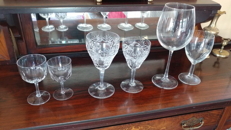 Wine glasses have gotten steadily bigger over the years. Left to right: wine glasses from the early 20th century; from 1968; from 2005