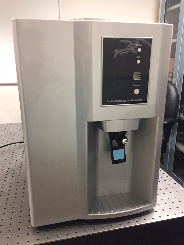 This prototype atmospheric water generator, or AWG, uses a special refrigerator to condense water vapor from the air. The device filters the water and deposits it into a collector for use.
