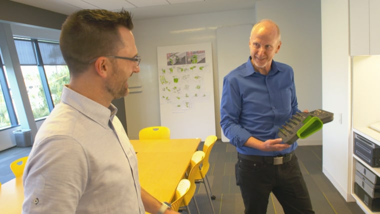 Chet Pipkin (right), founder and CEO of Belkin, speaks to employee in California-based office. He says he's learned how to be a better leader.