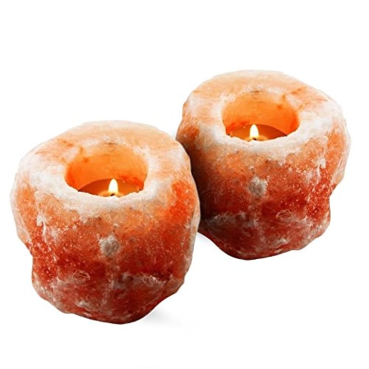 two orange colored rock candle holders