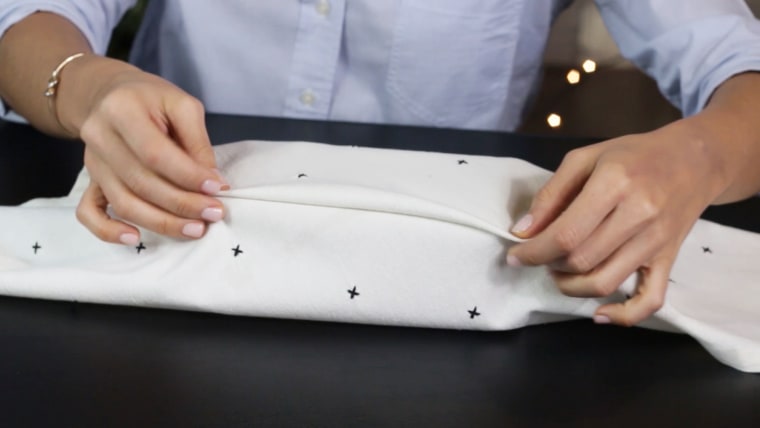 Create a clean seam by tucking the fabric.