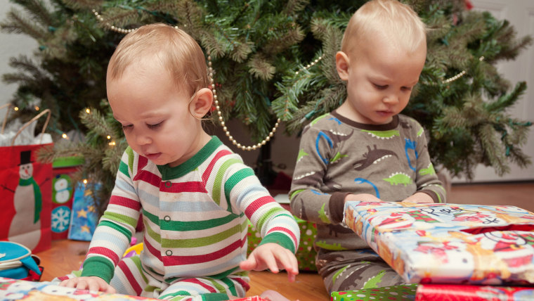 Brother and sister looking at Christmas presents