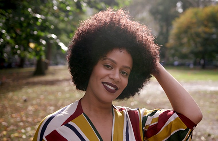 Fasbian poses 10 months after starting her natural hair journey. 