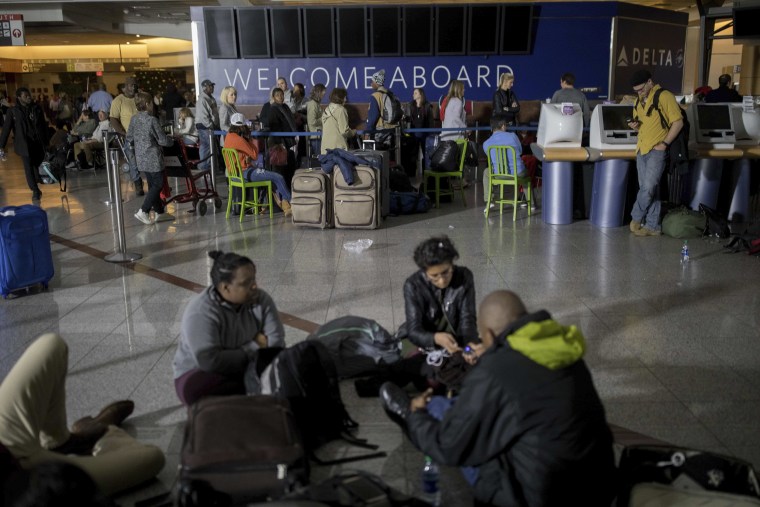 Image: Passengers wait after the lights went out at Hartfield-Jackson Atlanta International Airport, Dec. 17, 2017, in Atlanta.
