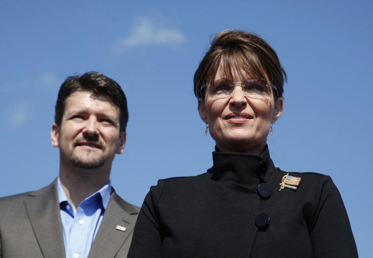 Image: Sarah Palin stands alongside her husband Todd during an outdoor campaign rally in Fairfax, Virginia, on Sept. 10, 2008.