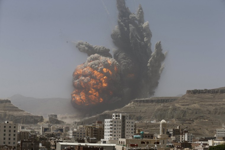 Image: Smoke rises during an air strike on an army weapons depot on a mountain overlooking Yemen's capital Sanaa