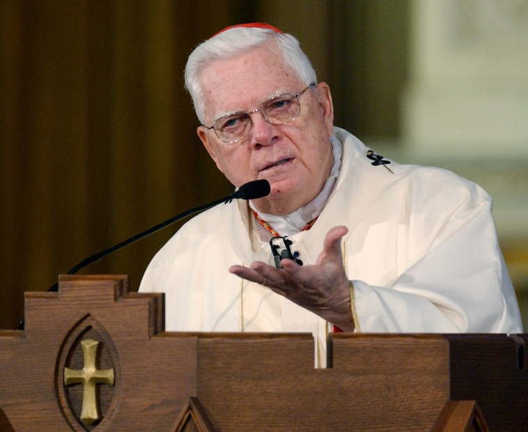 Image: Cardinal Bernard Law addresses the congregation at Holy Cross