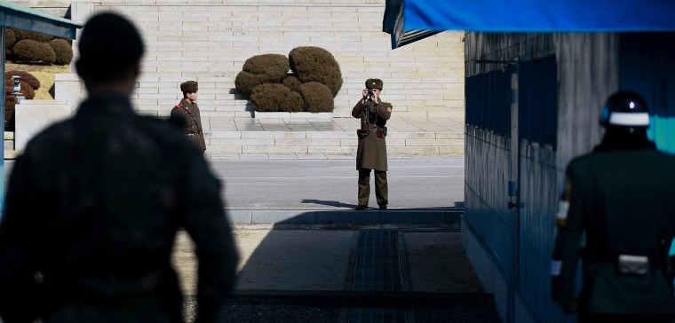 Image: South Korean troops fire warning shots as North Korean troops pursue defector