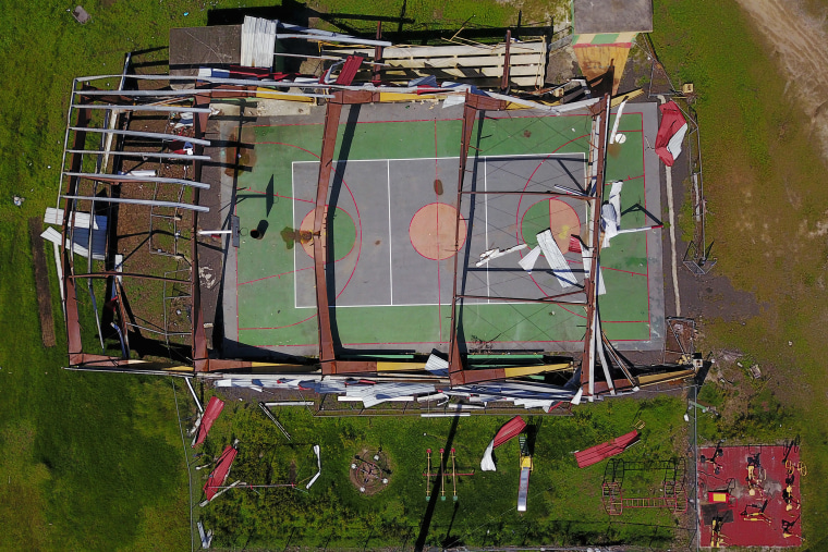 Image: The roof of a basketball court was destroyed in the Punta Santiago beachfront neighborhood of Humacao