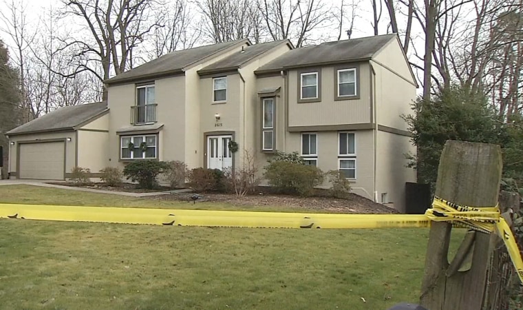 Image: Image: Crime scene tape outside the home of Scott Fricker and his wife Buckley Kuhn-Fricker in Reston Virginia