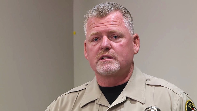 Sgt. Aaron Thompson speaks at a press conference