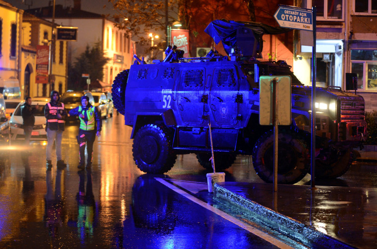 Image: An armoured police vehicle blocks a road leads to a nightclub where a gun attack took place during a New Year party in Istanbul
