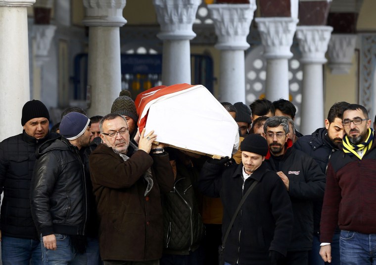 Image: Relatives carry the coffin of Arik, a victim of an attack by a gunman at Reina nightclub, during his funeral in Istanbul