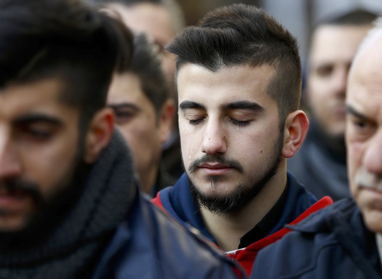 Image: Relatives react at the funeral of Arik, a victim of an attack by a gunman at Reina nightclub, in Istanbul